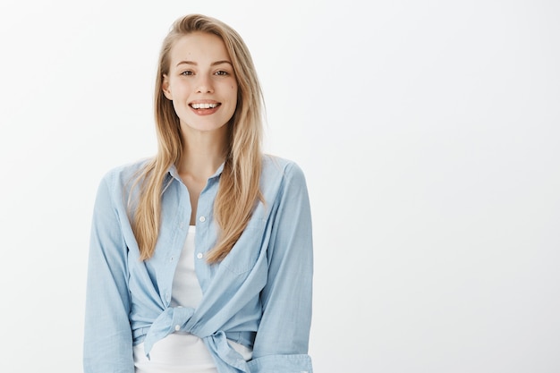 Free photo successful female entrepreneur in blue collar shirt