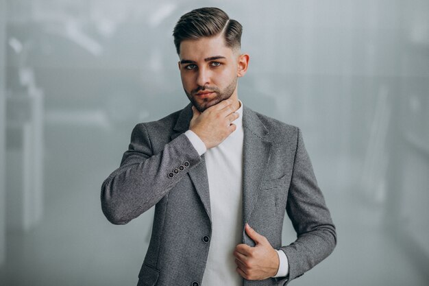 Successful handsome business man in an office