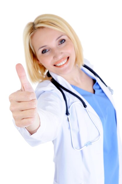 Successful and happy young female doctor showing thumbs-up