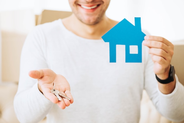 Free photo successful man with keys from new house