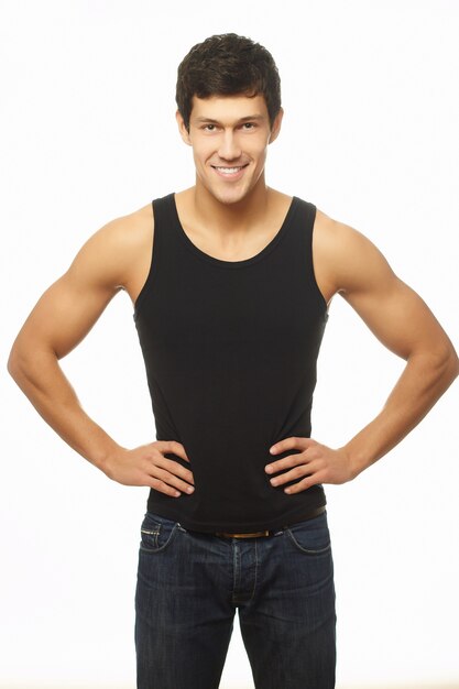 Successful muscled young man in black tanktop