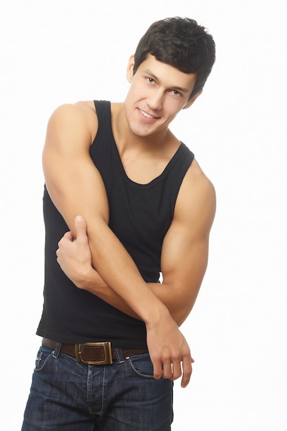 Free photo successful muscled young man in black tanktop