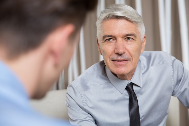 Free photo successful senior business leader talking to partner