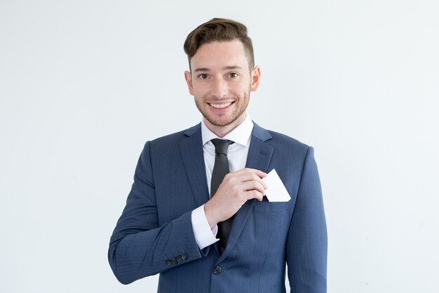 Successful young businessman with blank card