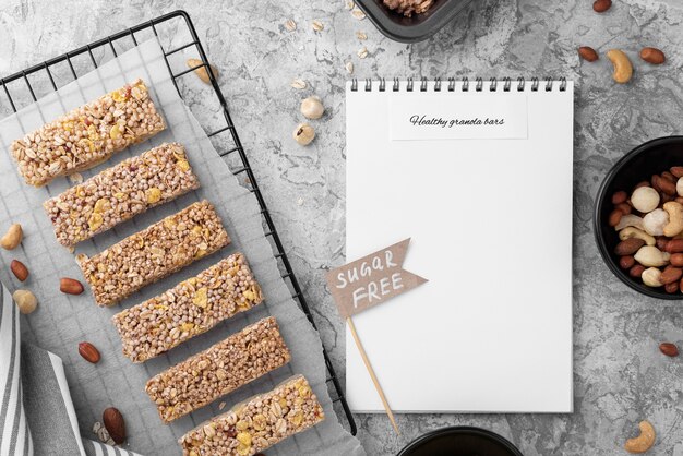 Sugar free snack bars and notebook top view