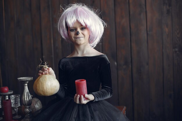 Sugar Skull little girl Halloween costume and makeup. Halloween party. Day of The Dead.