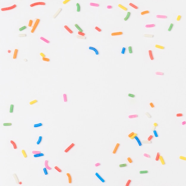 Sugar sprinkles on off white background