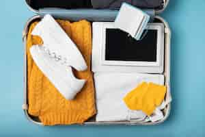 Free photo suitcase packed with travel paraphernalia