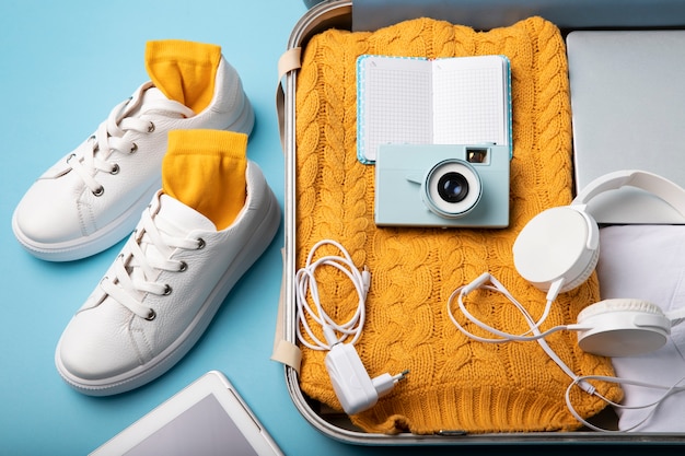 Suitcase packed with travel paraphernalia