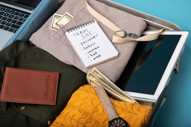 Suitcase packed with travel paraphernalia