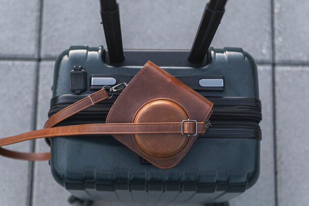 Suitcase and retro camera in leather case