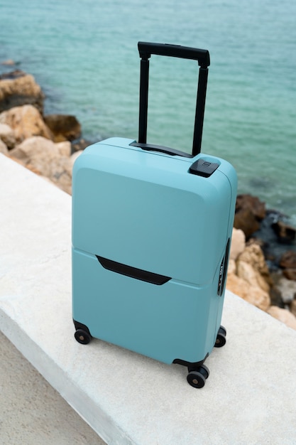 Free photo suitcase with wheels outdoors