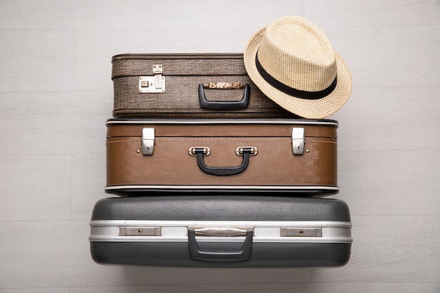 Suitcases for travel with straw hat