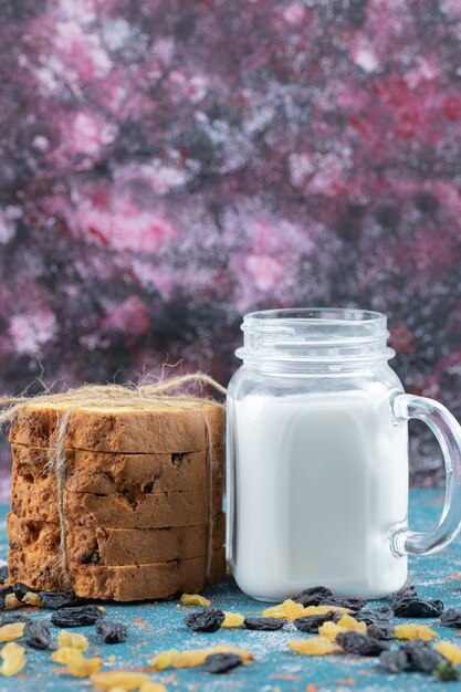 Sultana pie served with a jar of milk.