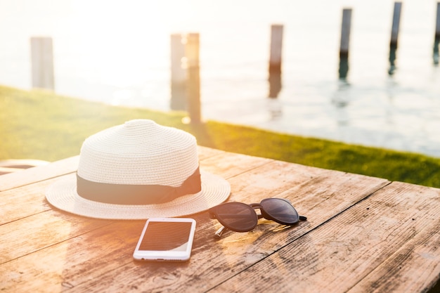 Summer accessories on wooden table