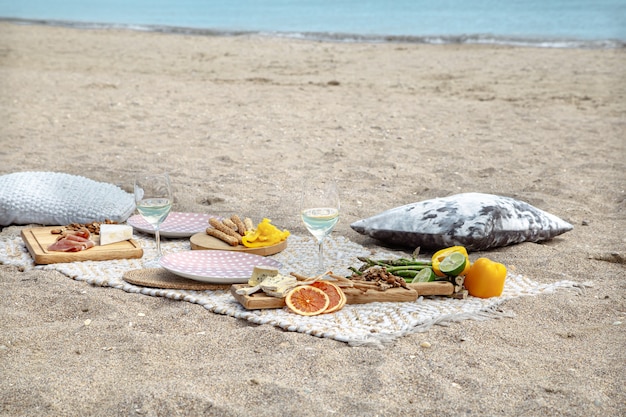 Summer beautiful romantic picnic by the sea . The concept of a holiday