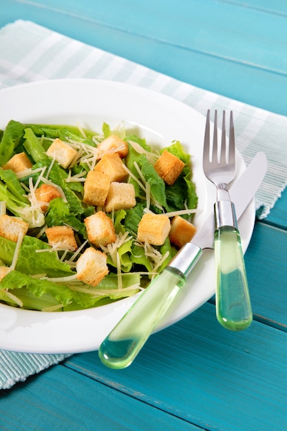 Summer caesar salad on picnic table