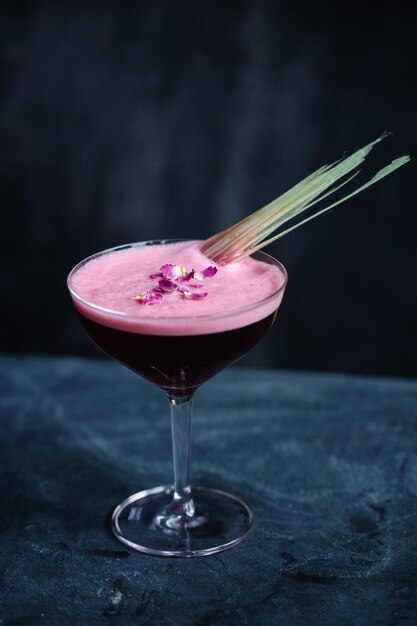 Summer cocktail with fruits and rose