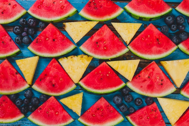 Summer composition with blueberries, watermelons and pineapples