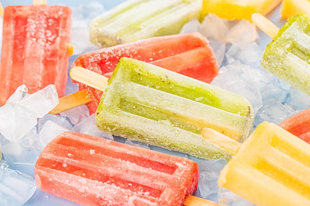 Free photo summer concept various fruit popsicles