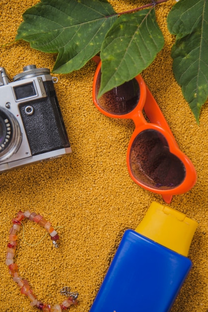 Summer concept with sunglasses and suncream