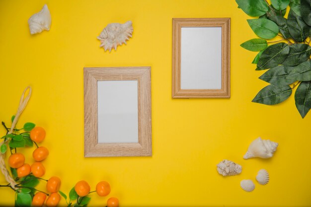 Summer concept with two frames and oranges