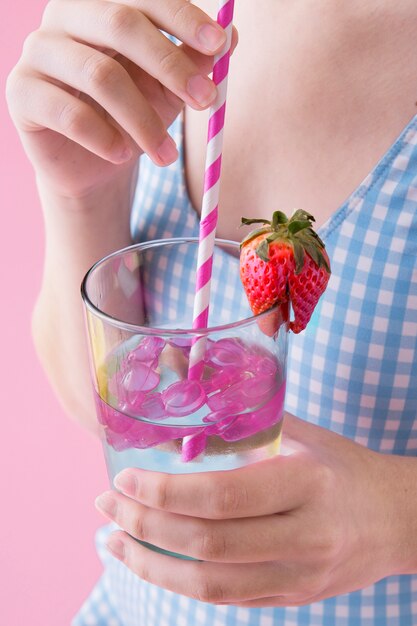 Summer concept with woman drinking cocktail