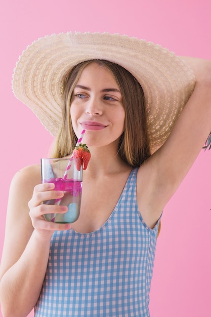 Summer concept with woman drinking cocktail