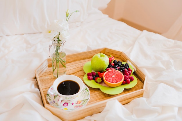 Summer fruit and fresh coffee on tray