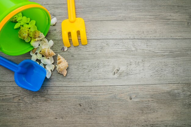 Summer objects on wooden surface with blank space