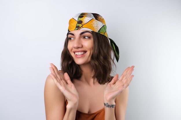 Free photo summer portrait of a young woman in a sports swimsuit headscarf