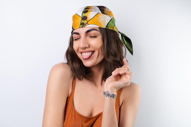 Summer portrait of a young woman in a sports swimsuit headscarf