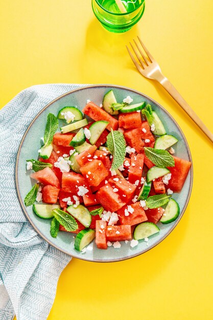 Summer salad with watermelon and cucumbers
