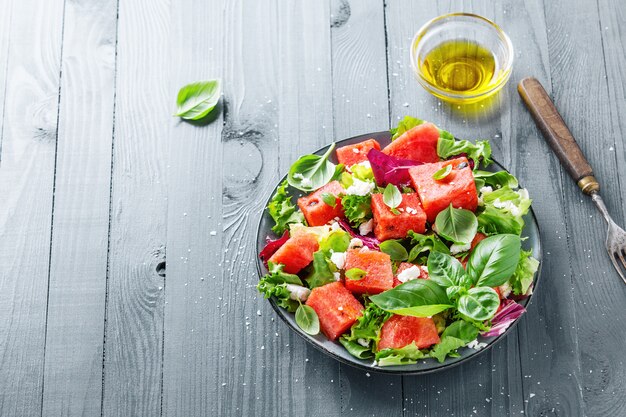 Summer salad with watermelon and salad leaves