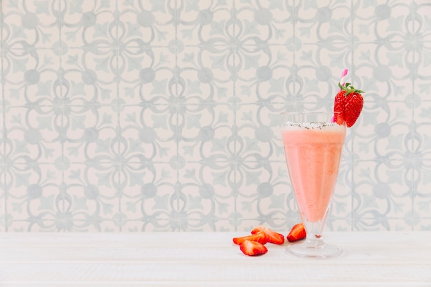 Summer smoothie with strawberry and copyspace on left