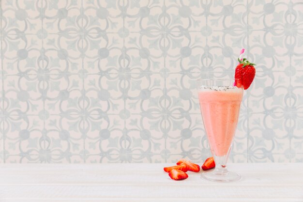 Summer smoothie with strawberry and copyspace on left