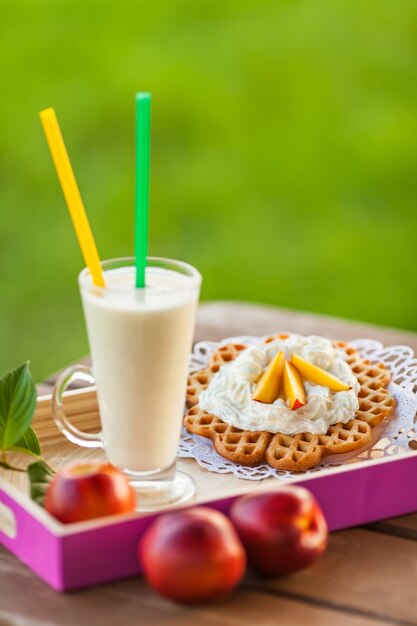 Summer snacks on wooden table outdoors