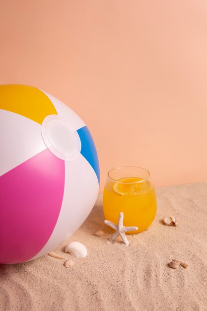 Summertime vibes with sand and orange cocktail