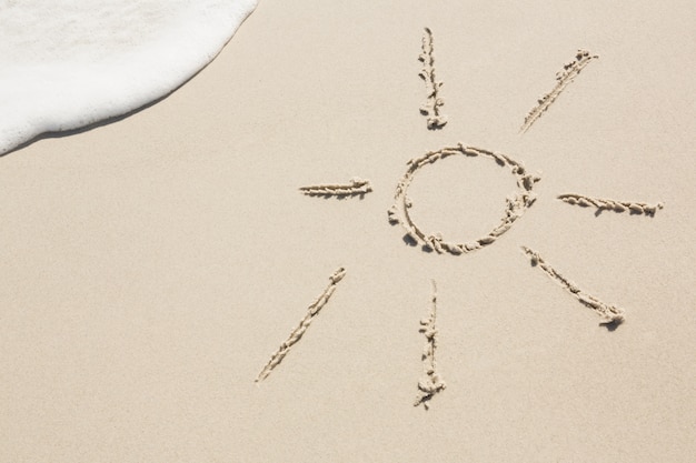 Free photo sun drawn on sand