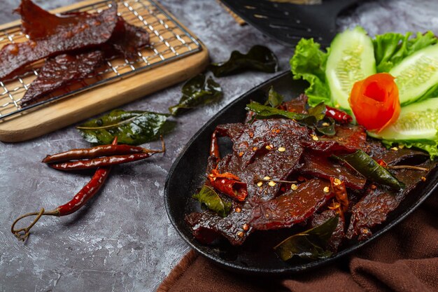 Sun dried beef fried with tomato sauce and steamed rice