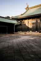 Free photo sun hitting the traditional japanese wooden temple