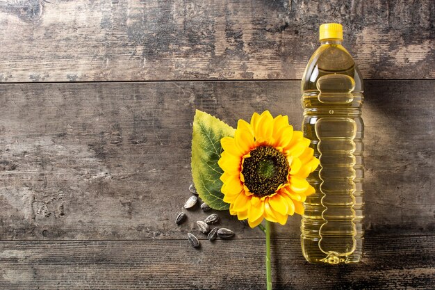 Sunflower oil plastic bottle on wooden table