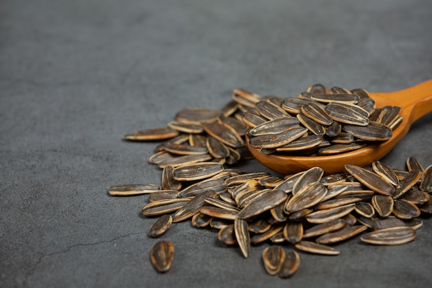 Sunflower seeds are placed on the black board.