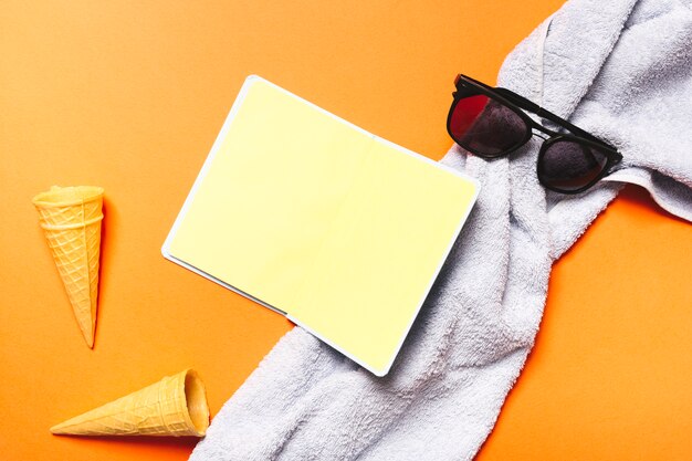 Sunglasses towel notebook and ice cream waffle cones