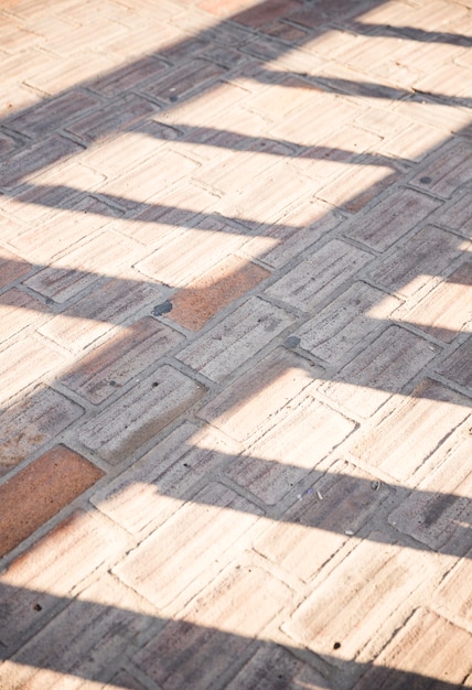 Free photo sunlight on concrete pavement sidewalk