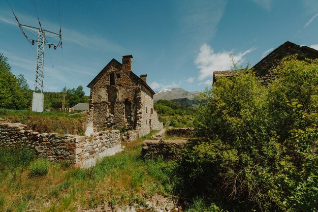 Sunny landscape of a field with a house