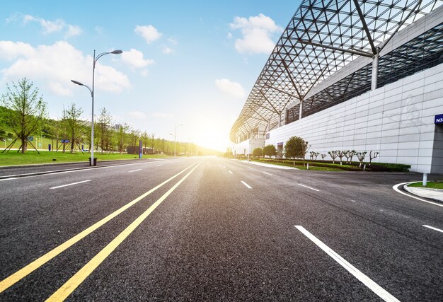 Sunny landscape with a long road