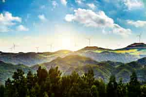 Free photo sunny landscape with windmills