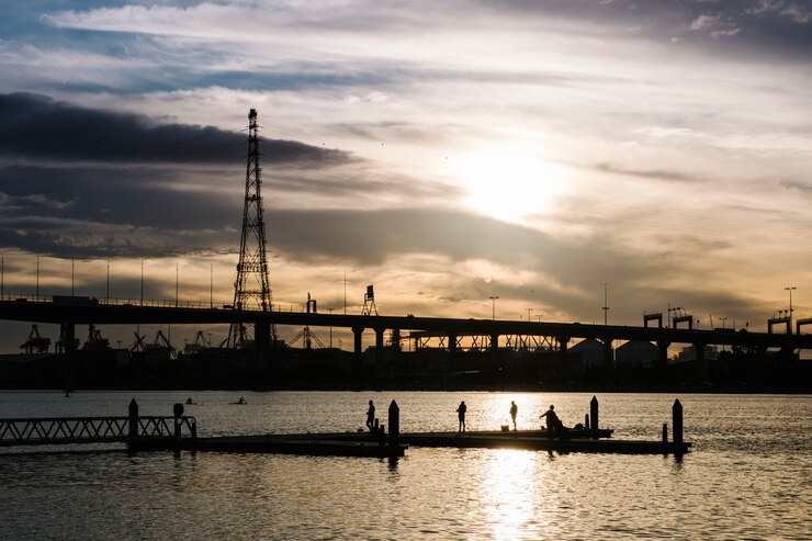 Free Photo sunset at sea and the city