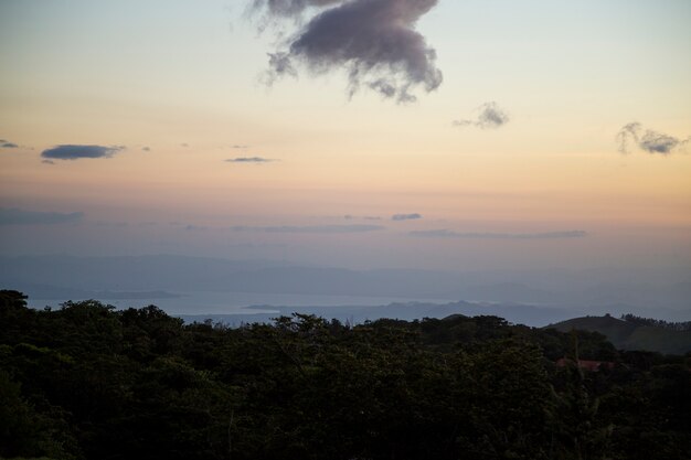 Sunset view of tropical rainforest in costa rica